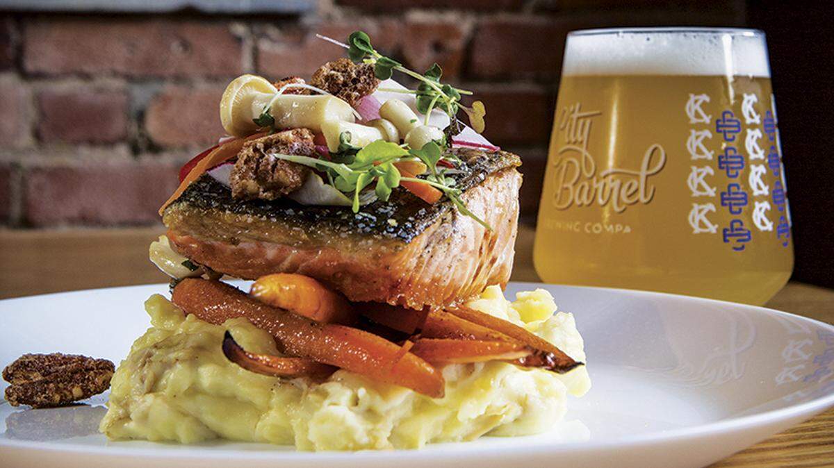 City Barrel Brewing Co.’s crispy skin salmon with house-brewed beer.