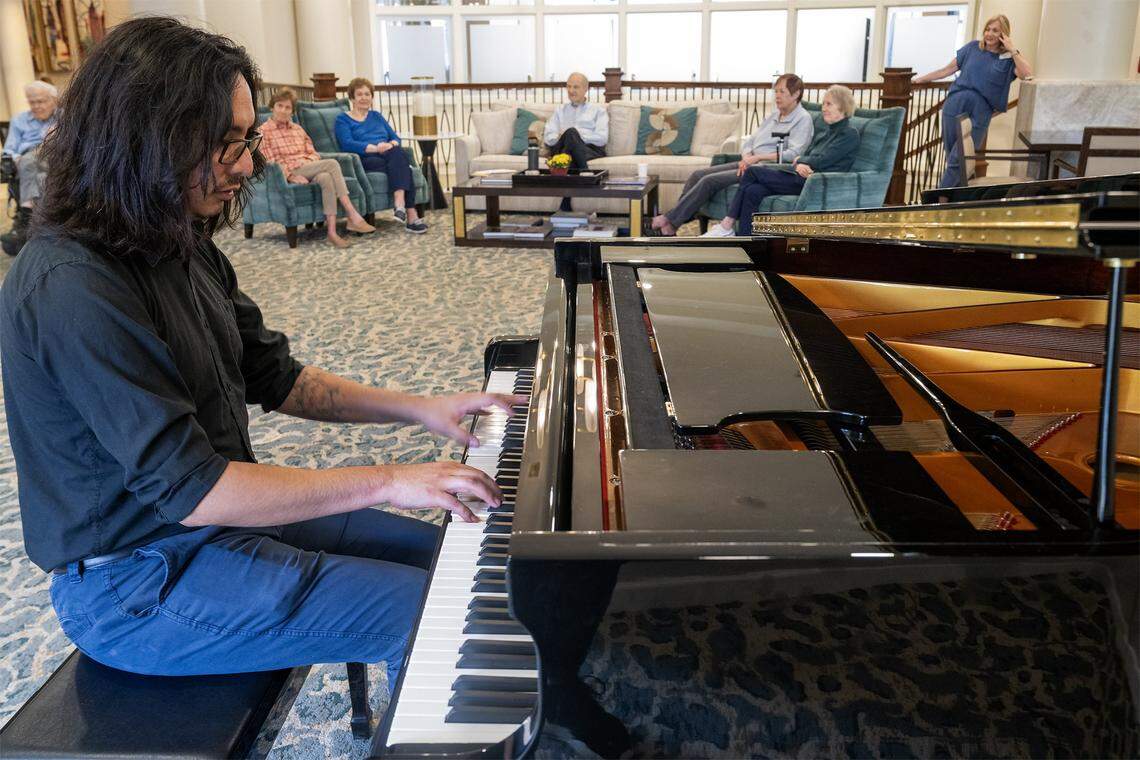 Graduate piano student Naren Palomino Pardo, who is an artist-in-residence at Claridge Court, a senior living community, played the piano for residents on Monday, Oct. 13, in Prairie Village. Palomino Pardo, a native of Bolivia, is studying at the University of Missouri–Kansas City Conservatory and lives within the senior community.
