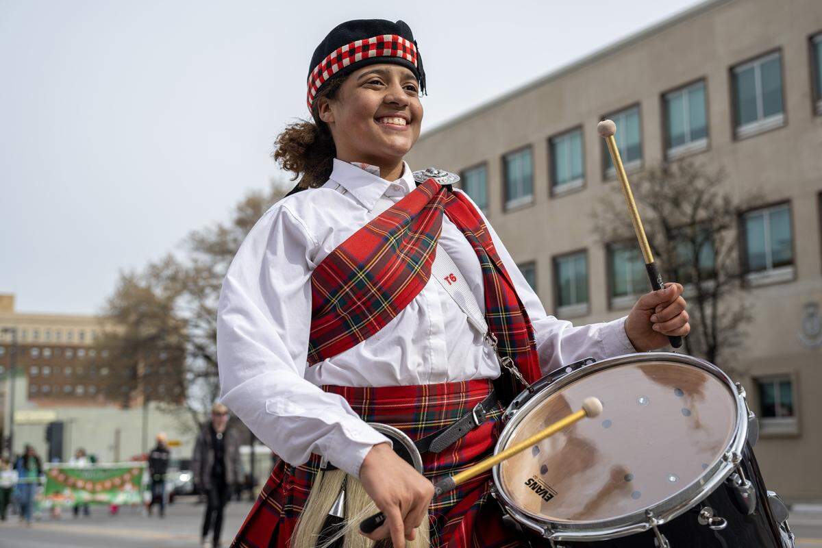 A drummer from the Kiltie Drum and Bugle Corps participates during the St. Patrick's Day parade along Broadway Boulevard on Tuesday, March 17, 2026, in Kansas City.
