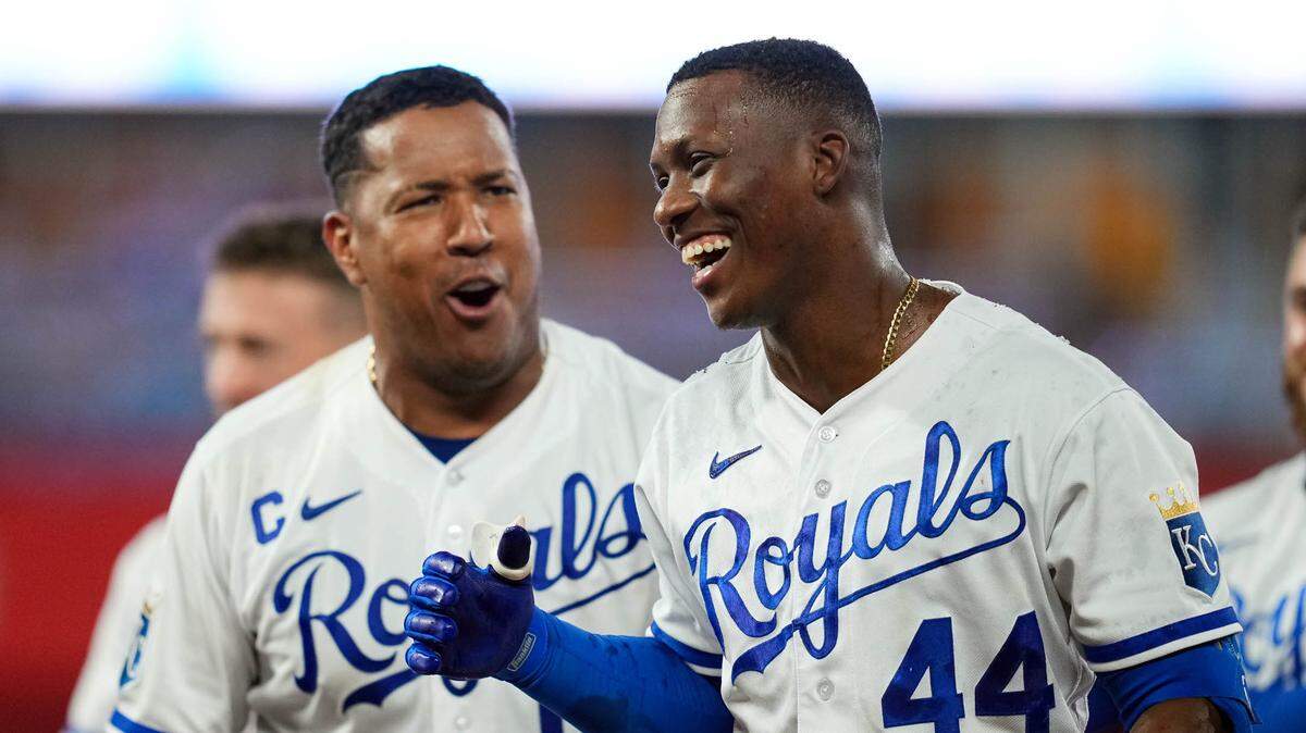 Royals left fielder Dairon Blanco, right, celebrates with catcher Salvador Perez after dropping a walk-off bunt against the Seattle Mariners Monday night at Kauffman Stadium.