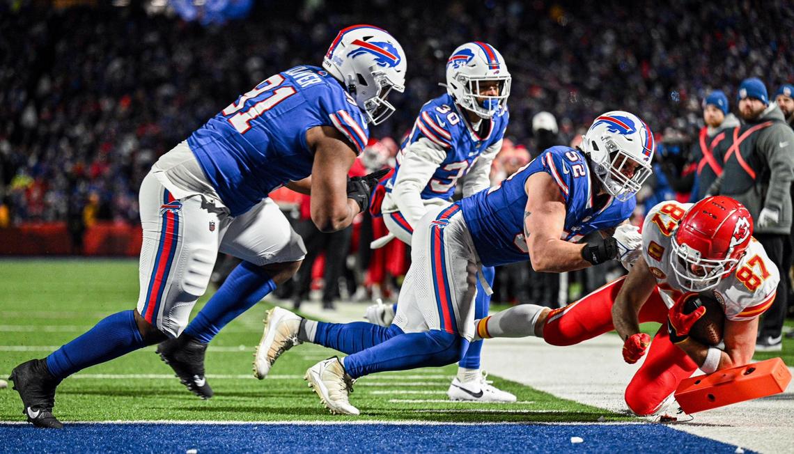 Kansas City Chiefs tight end Travis Kelce (87) knocks over the pylon as he scores a touchdown on a reception against the Buffalo Bills in the third quarter Sunday, Jan. 21, 2024, at Highmark Stadium in Orchard Park, New York.