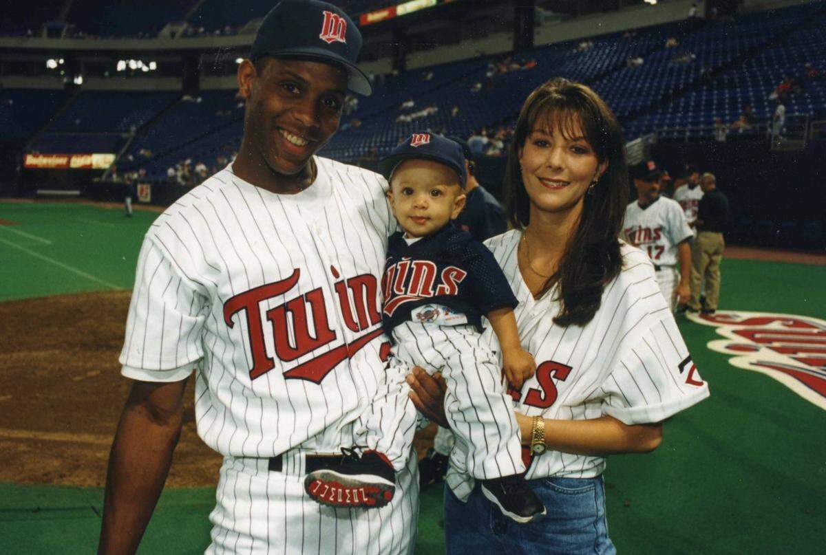 Patrick Mahomes as a baby when his dad was playing for the Minnesota Twins. At right is is mom, Randi.