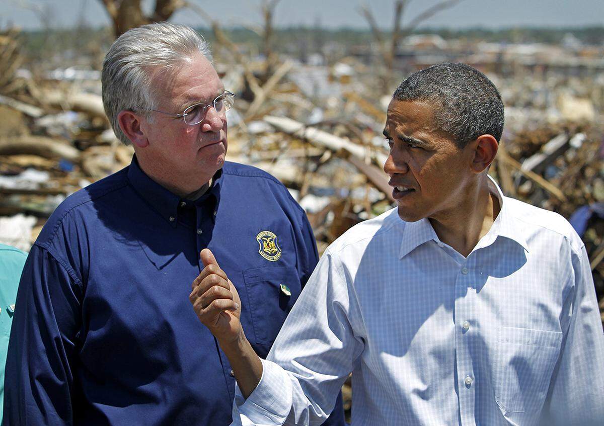 President Barack Obama visited some of those whose homes were destroyed a week ago in the massive tornado that hit Joplin, Mo. The president walked through several blocks of a residential area that was extensively damaged by the storm that claimed well over 100 lives. He paused with Missouri Govenor Jay Nixon after the tour to briefly comment on the devastation. RICH SUGG/The Kansas City Star_05292011.