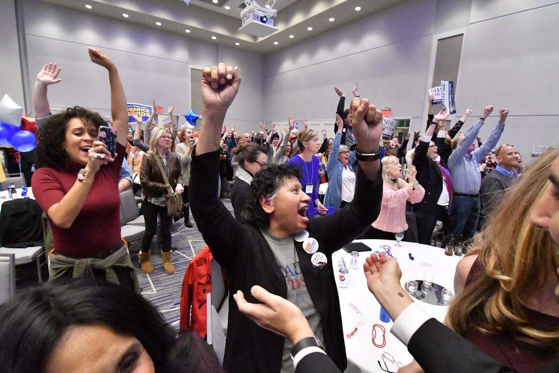 Sharice David’s mother, Crystal Herriage, cheered after a cable news network declared Davids the winner in the Kansas 3rd Congressional District race Tuesday during an election watch party in Olathe.