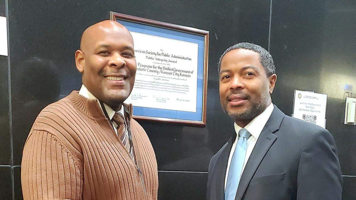 Damon Mitchell, right, shakes hands with former Mayor Tyrone Garner, left, in a 2025 photo posted to the Wyandotte County District Attorney’s Office’s Facebook page. Gov. Laura Kelly appointed Mitchell as the county’s newest district court judge, and he will replace Judge Constance Alvey, who recently retired.