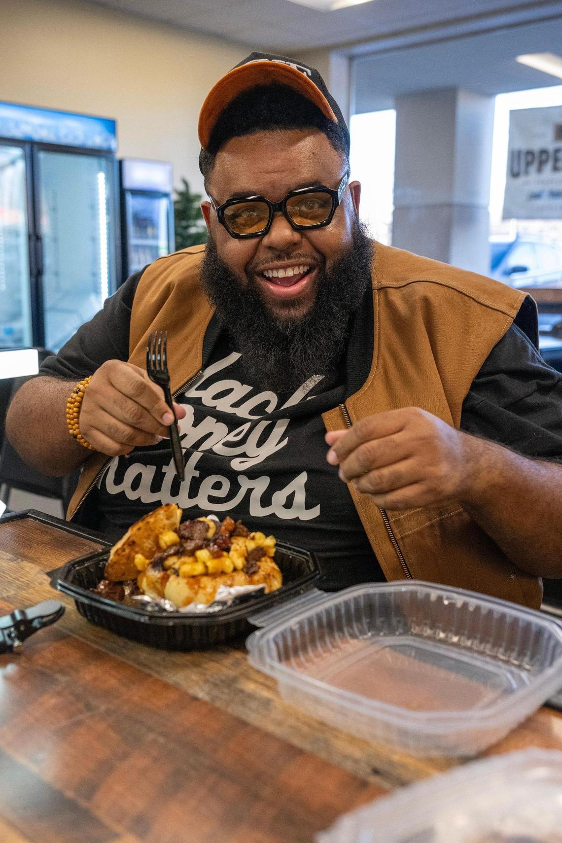 Glenn Robinson prepares to try the brisket mac and cheese bread bowl at The Upper Cut KC in Liberty.