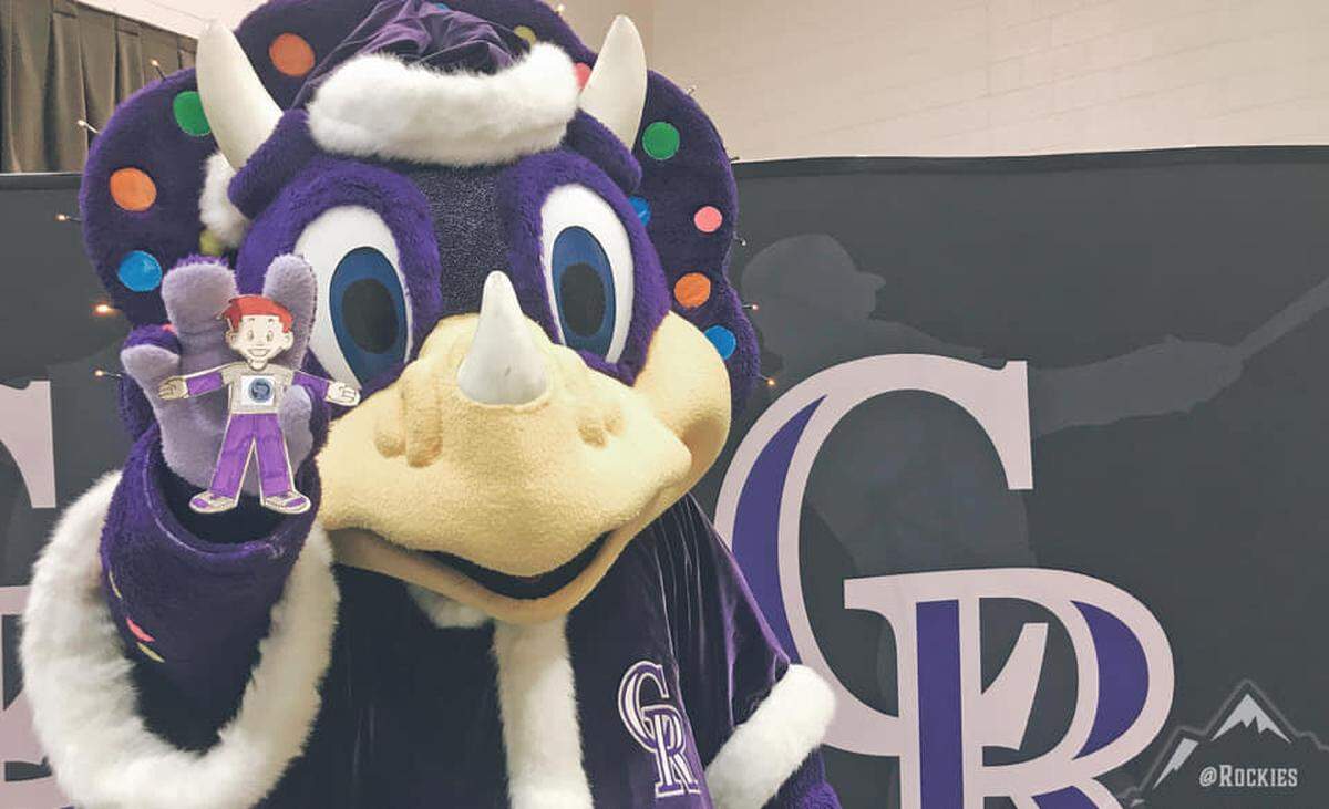 Flat Stanley got to meet the team’s preshistoric mascot, Dinger.