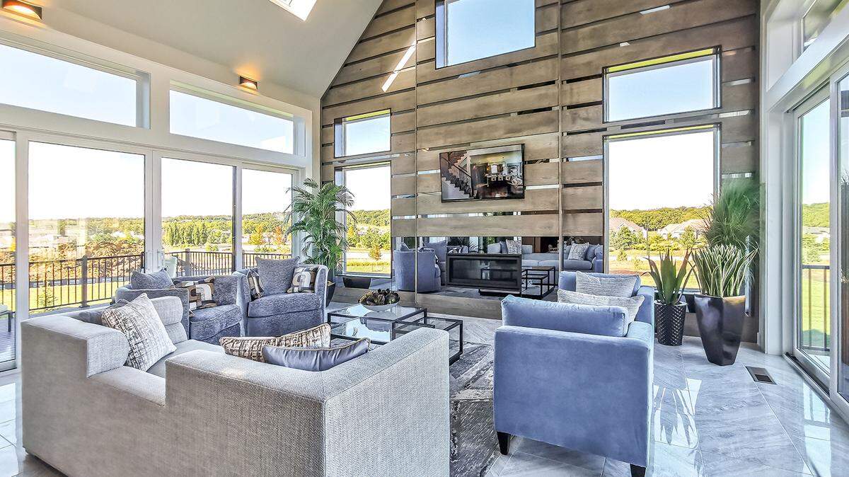 Don Julian Builders’ signature 4-seasons room provides the perfect place to enjoy expansive views of the natural setting in the Village of Loch Lloyd.
