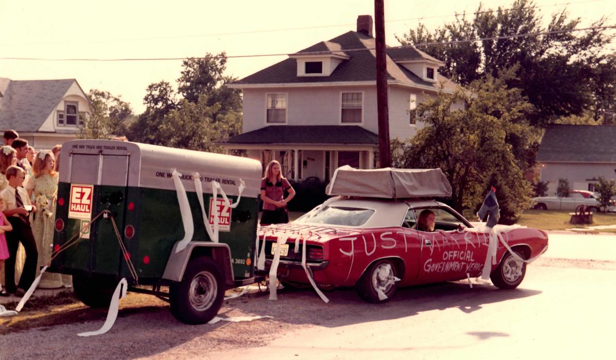 Newlyweds Beth and Marc Biddison pulling their belongings behind the Cuda Chief, August 1972.