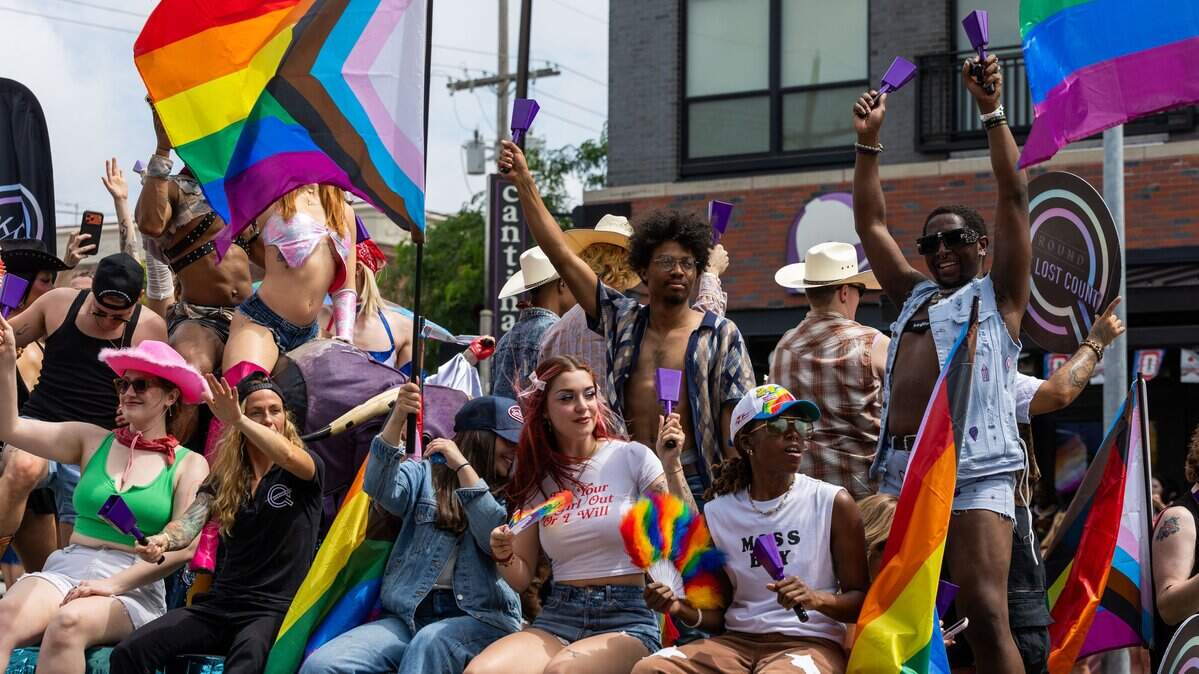 Parade attendees dance and cheer on their float as they make their way through Kansas City's Annual Pride Parade at Westport Rd on Saturday, June 6, 2026.
