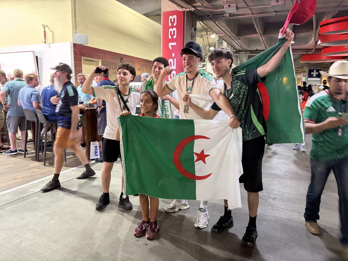 Jemel Gouet (right) poses with friends ahead of Algeria’s final group stage match against Austria Saturday, June 27 at Arrowhead Stadium.