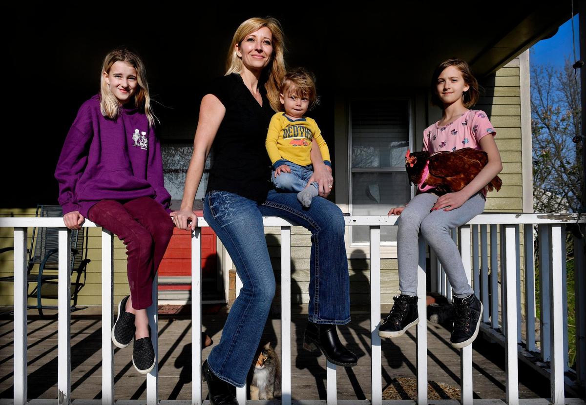 Jennifer Williams’ family moved to a rural plot near Spring Hill for the peace and quiet. She home schools the children — from left, Seven, Lorenzo and Indigo — and works at home as a tax preparer. Her husband works as a welder in his own shop.