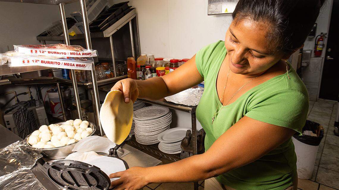 Bianca Gomez, wife to Martin Lopez, makes fresh tortillas Tuesday morning, December 13, 2022. Martin Lopez and his family moved from Guatemala to the United States in 2001. He worked as a server for 12 years here in Florida at a Mexican restaurant. ÒI then worked as a chef for one year and decided to open my own Mexican restaurant,Ó Lopez said Tuesday at his newest restaurant location in Ocala called Brisas del Mar, which is English means Sea Breeze. He has a total of three locations, all named the same, in Ft. Pierce and Lady Lake. Ocala is his newest just opening last week. Brisas del Mar Mexican Restaurant and Grill is located at 1900 S. Pine Avenue in Ocala, FL. Hours are Monday through Saturday, 11 a.m. to 10 p.m. and Sunday from 11 a.m. to 9 p.m. [Doug Engle/Ocala Star Banner]2022 Oca Brisas Del Mar