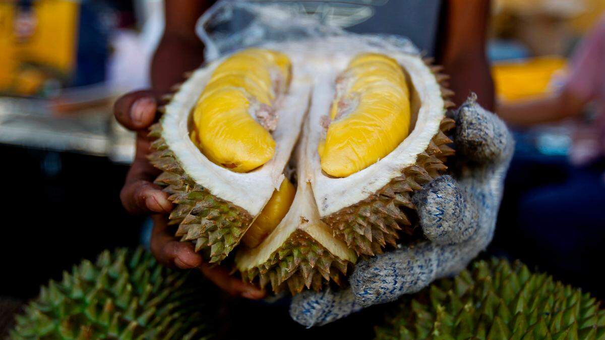 In this Nov. 25, 2017, file photo, a cut Musang King durian is shown by a vendor during the International Durian Cultural Tourism Festival in Bentong, Malaysia.