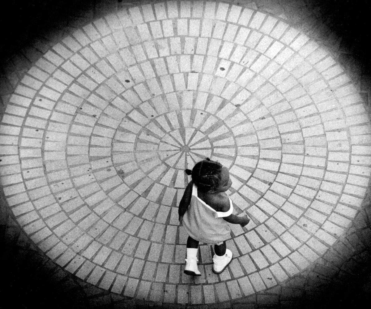 The City Center Square sidewalk looked like a maze as this little girl walked in several directions trying to find the right path to her mother in 1979 file photo
