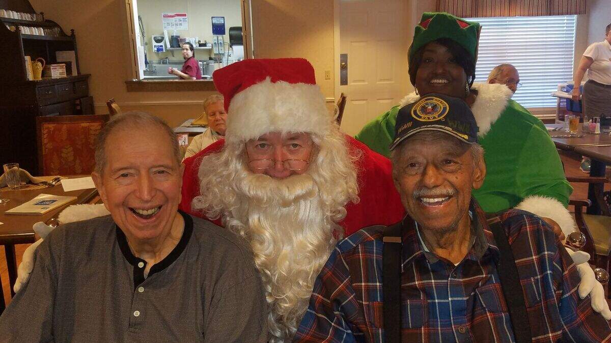 Brighton Gardens in Prairie Village was the birthplace of a friendship between Walter “Chip” Dickey (left) and George Sayles (right), who met Santa Claus (portrayed by Rick Stuart) at the senior community’s Breakfast with Santa event on Dec. 7. Dickey, 80, of Prairie Village, retired from Hallmark as a tax solution attorney. Sayles, 92, hails from Kansas City. The Navy veteran, 92, retired from General Motors where he worked for 40 years.