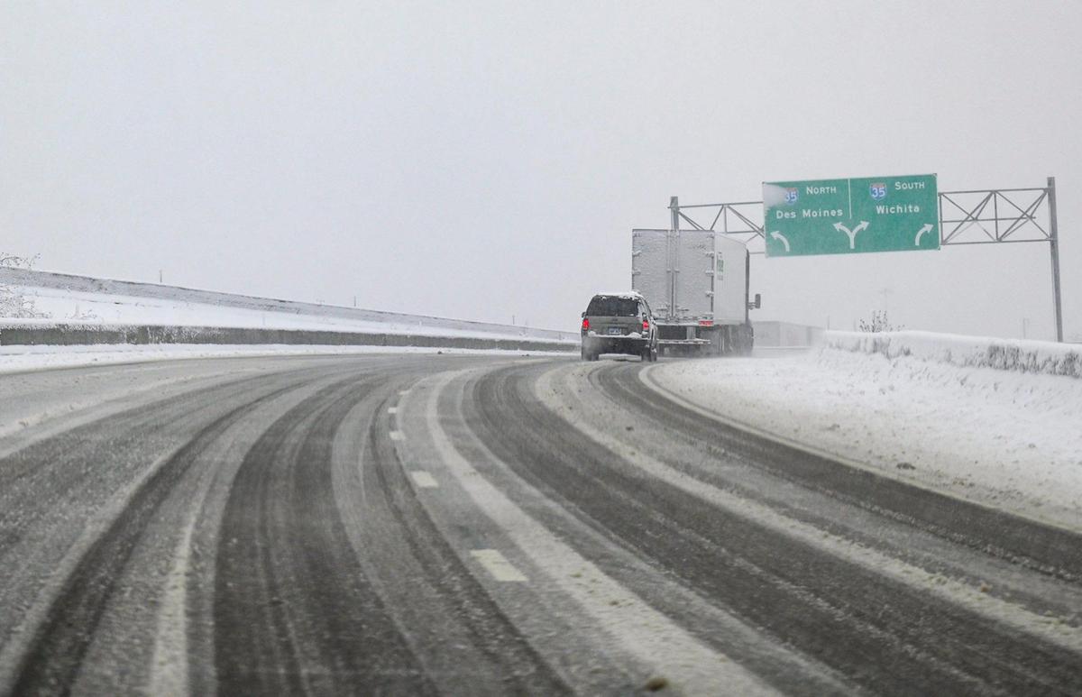 Vehicles slowly navigated the slick, snow-covered off ramp near Interstate 35 in Lenexa on Tuesday, Jan. 9, 2024, after a winter storm dumped several inches of snow in the Kansas City area,.
