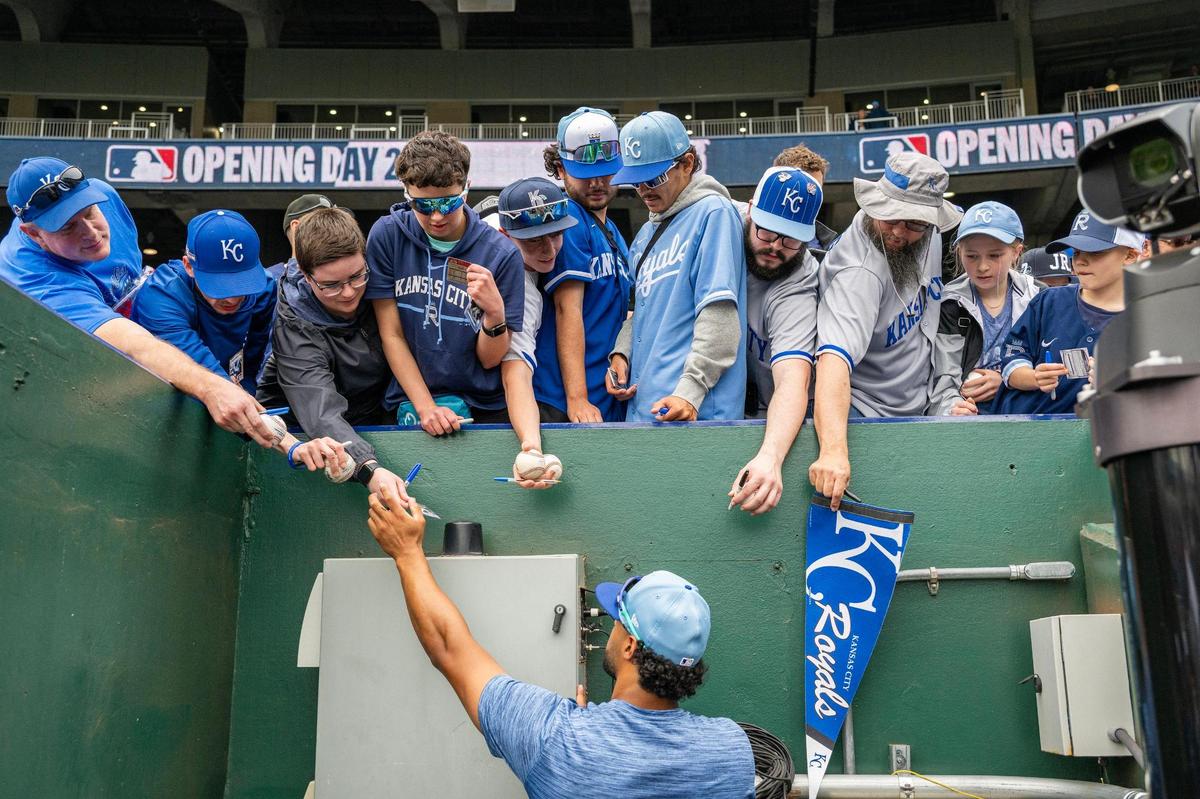 Kansas City Royals outfielder MJ Melendez (1) signs autographs for fans before the MLB opening day game against the Cleveland Guardians on Thursday, March 27, 2025, at Kauffman Stadium.