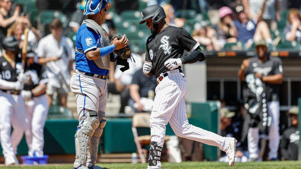 As Royals catcher Salvador Perez looks on, White Sox center fielder Luis Robert Jr. crosses home plate after hitting a solo home run on Sunday at Guaranteed Rate Field in Chicago