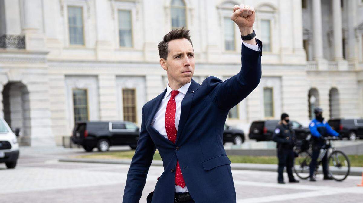 U.S. Sen. Josh Hawley of Missouri raised a fist of support to crowds gathered at the U.S. Capitol on Jan. 6 to protest certification of President-elect Joe Biden’s win. The crowd soon amassed as a mob that attacked the Capitol building.