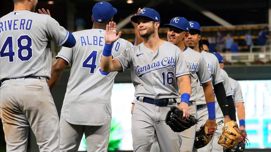 Kansas City Royals’ Andrew Benintendi (16) goes through the celebration line after the Royals defeated the Minnesota Twins 6-4 in 11 innings in a baseball game Friday, Sept. 10, 2021, in Minneapolis. Benintendi had a two-run homer in the 11th inning and a three-run homer in the first inning. (AP Photo/Jim Mone)