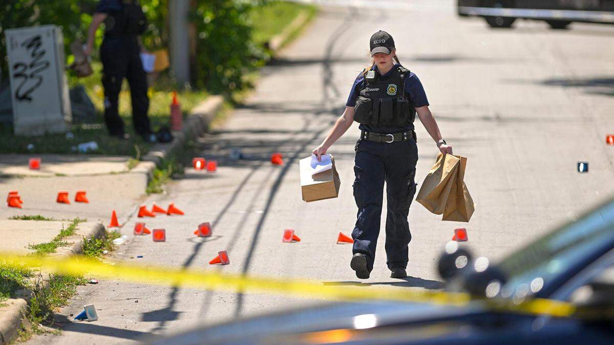 Police and crime scene investigators were on the scene collecting evidence where three people died and six were injured following a shooting early Sunday near 57th Street and Prospect Avenue in Kansas City.