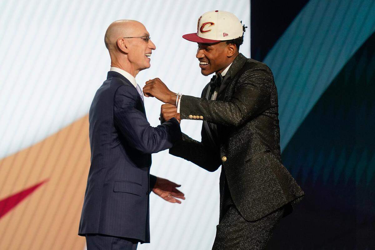 Ochai Agbaji embraces NBA Commissioner Adam Silver after being selected 14th overall by the Cleveland Cavaliers in the 2022 NBA Draft in New York.