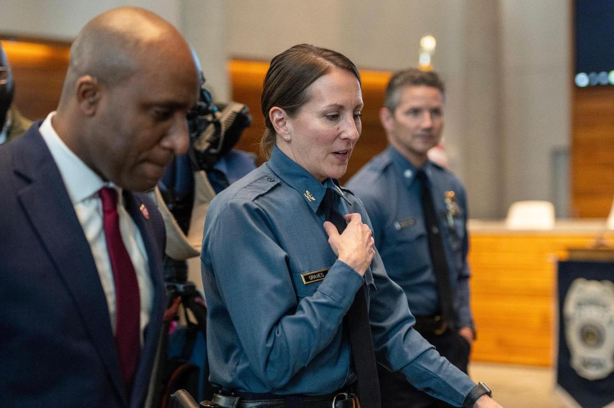 Kansas City Police Chief Stacey Graves, center, walks out with Kansas City Mayor Quinton Lucas after a press conference at Kansas City Police Department Headquarters on Wednesday. Chief Graves addressed violent crime trends in 2023 and outlined safety measures for the upcoming year.