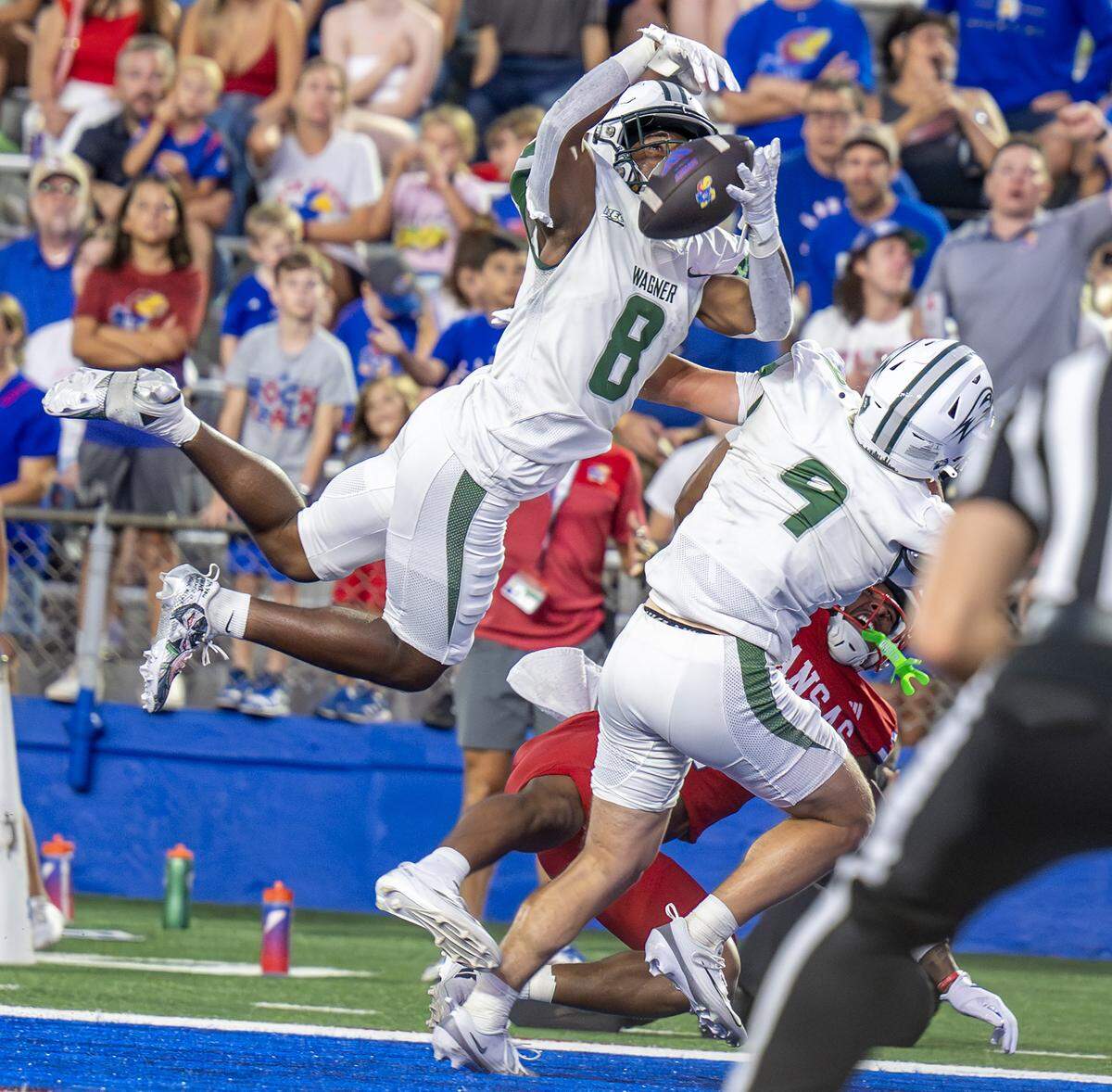 Wagner DB Jayden Brown (8) makes an interception during the second quarter of a game against Kansas at David Booth Kansas Memorial Stadium on Friday, Aug. 29, 2025, in Lawrence.