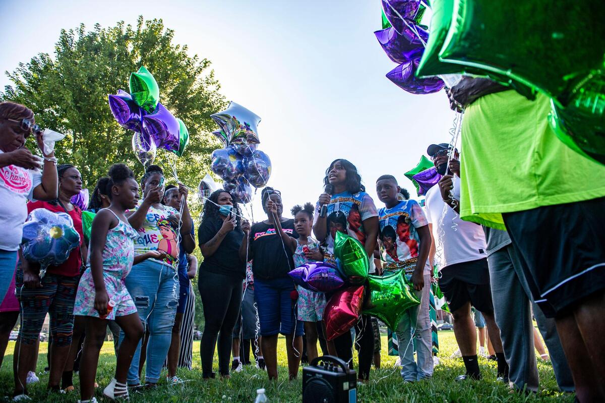 Quiana Martin speaks about the life of her mother, Shirley Muhammad during the vigil to celebrate her life and the lives of Jaelin Ransom and Tyla Ransom, Thursday, July 29, 2021 at Stanford Brown Park in Kansas City. Friends and family gathered to let go of balloons and celebrate their loved ones lives.