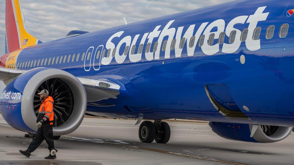A passenger aboard a Southwest Airlines flight from Raleigh-Durham, North Carolina, to Kansas City was met at gate by police after being disruptive aboard the plane Saturday evening, an airline spokesperson said..