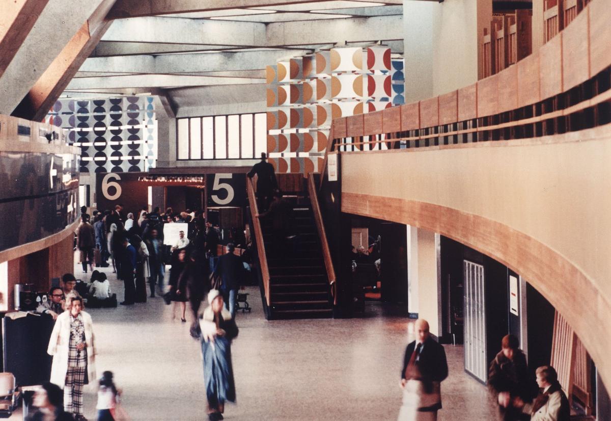 A photo likely shot shortly after the Kansas City International Airport opened in 1972 shows the continuous curved interior of one of the semi-circular terminals.