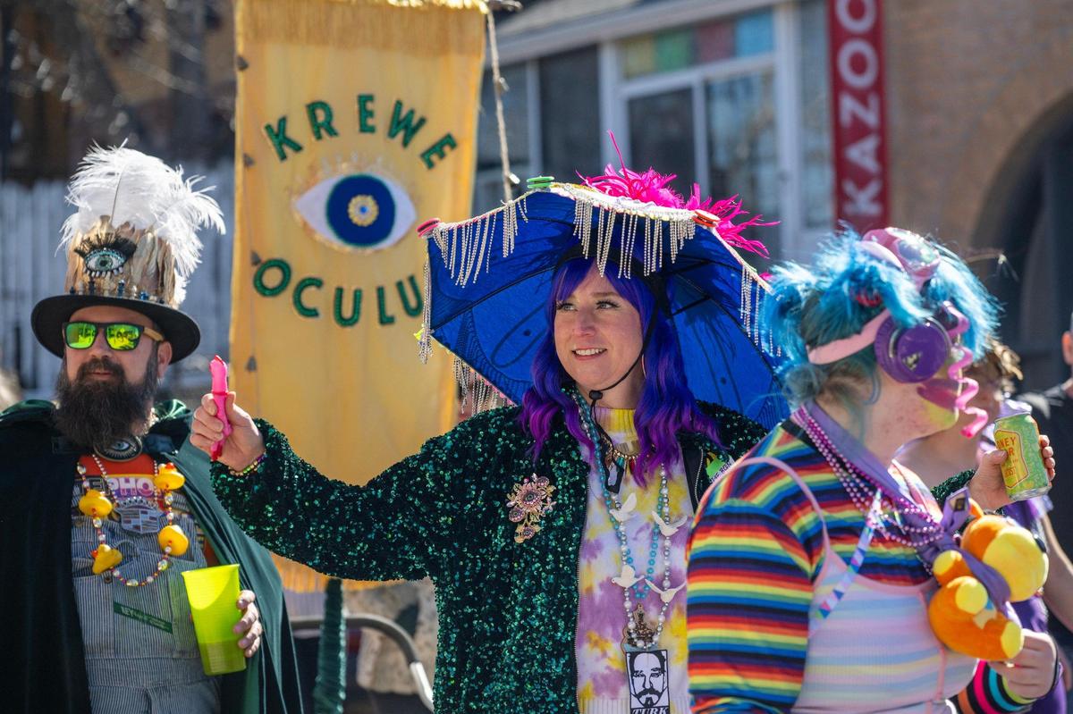 Parade participants walk along Summit Street during the annual Krewe de Prank parade on Sunday, March 2, 2025, in Kansas City.
