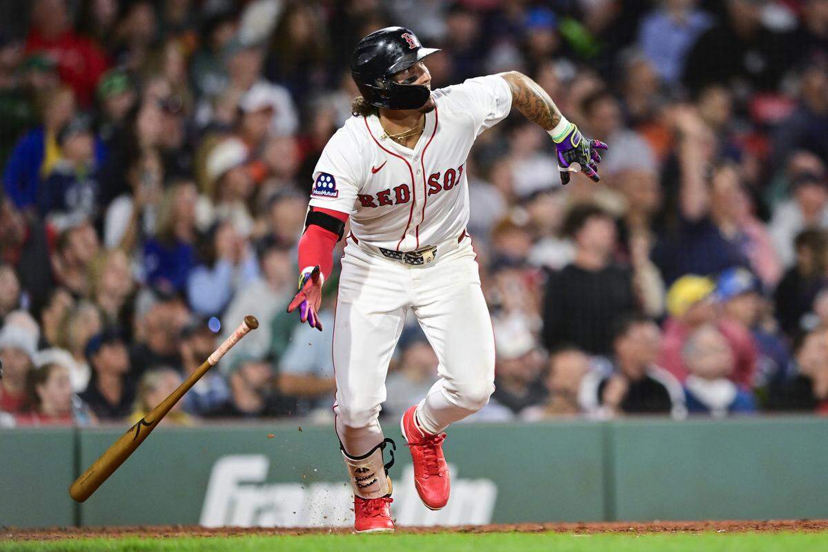 Jarren Duran #16 of the Boston Red Sox hits a sacrifice fly to bring Alex Bregman #2 (not pictured) home in the seventh inning against the Baltimore Orioles at Fenway Park on August 18, 2025 in Boston, Massachusetts.
