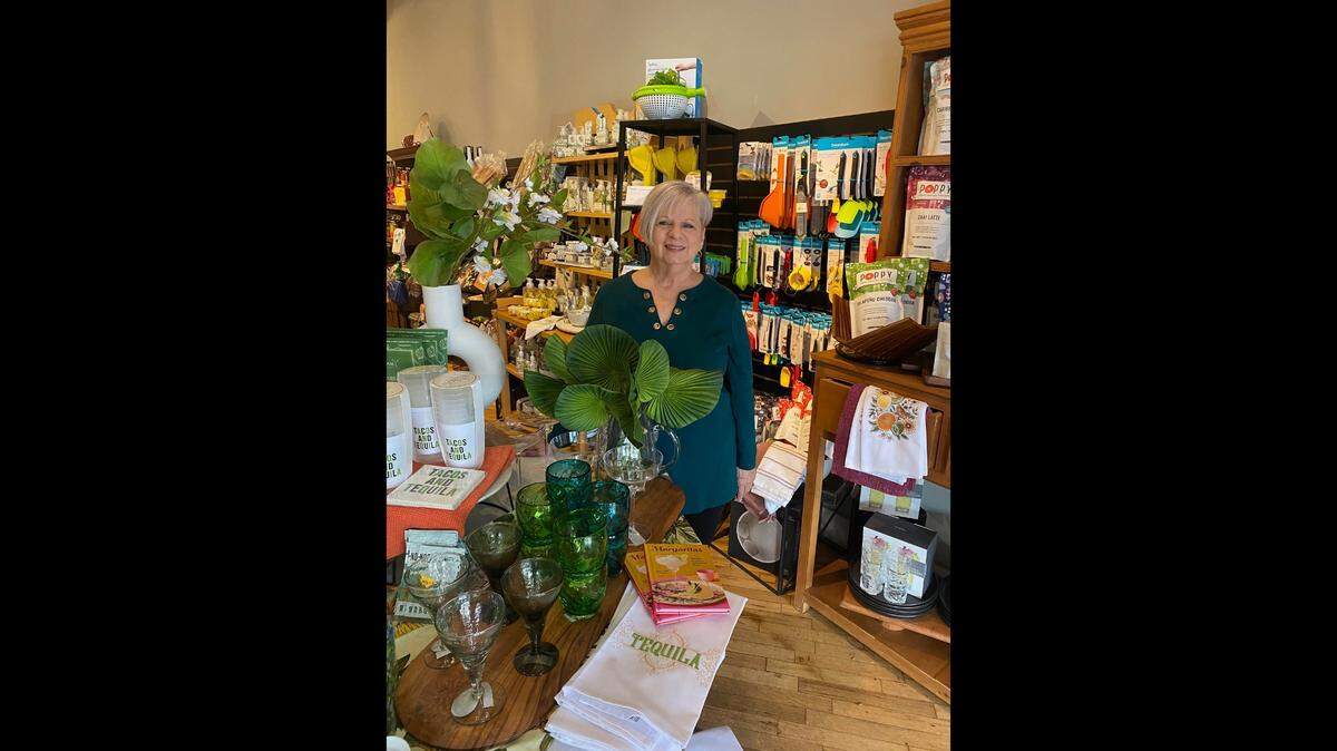 Marilyn James is pictured in front of one of the store’s displays.