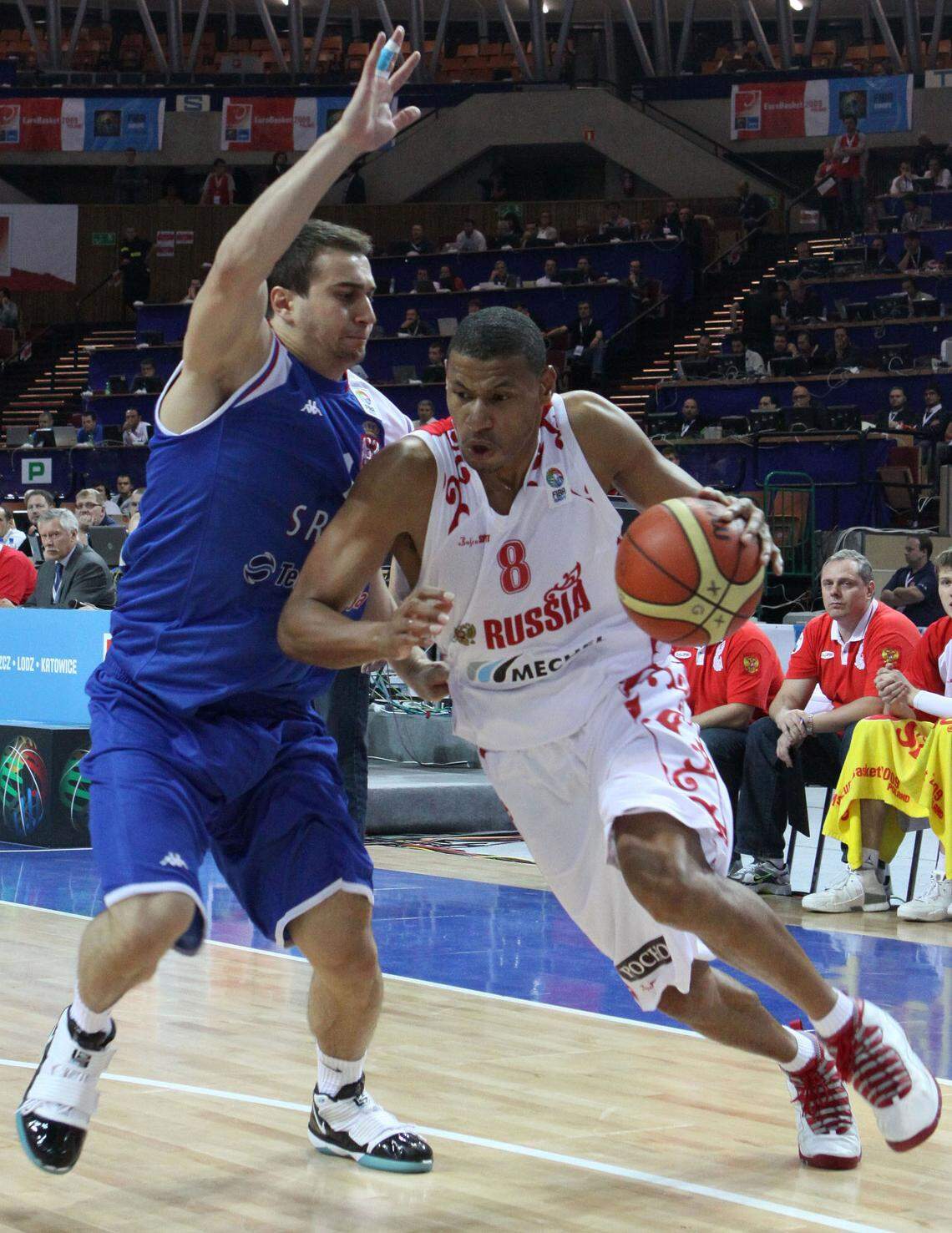 Kelly McCarty, right, playing during the EuroBasket 2009 European Basketball Championships, trained Mizzou players Kobe and Kaleb Brown.