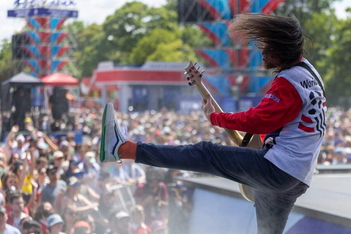 All American Rejects Guitarist Mike Kennerty stomps and jumps around on stage during their FIFA Fan Fest concert at Fan Fest on Saturday, July 11, 2026.