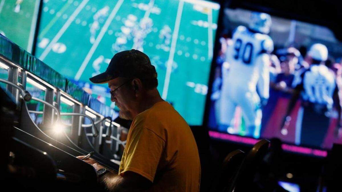 A bettor at the Westgate SuperBook in Las Vegas, where wagering on college football games is rising at the expense of betting on NFL games, in 2019.