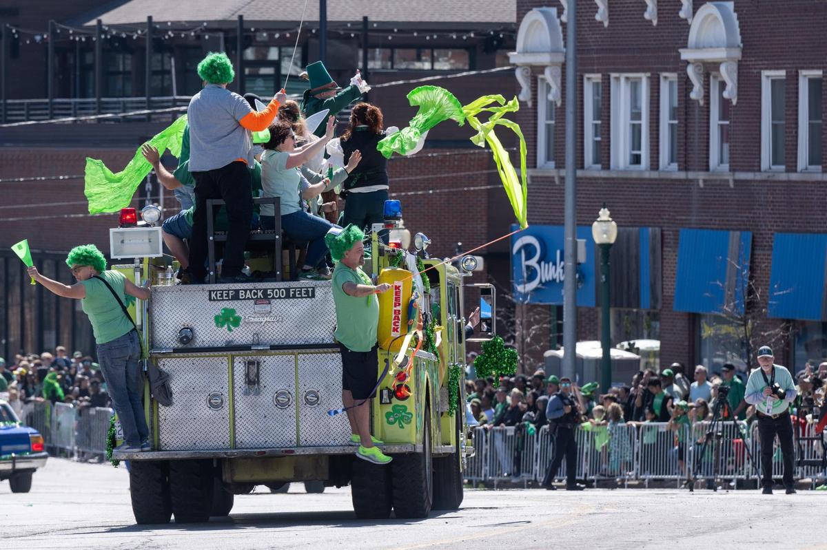 A South Platte fire truck drives down Broadway during the Kansas City St. Patrick’s Day Parade on Monday, Mar. 17, 2025.