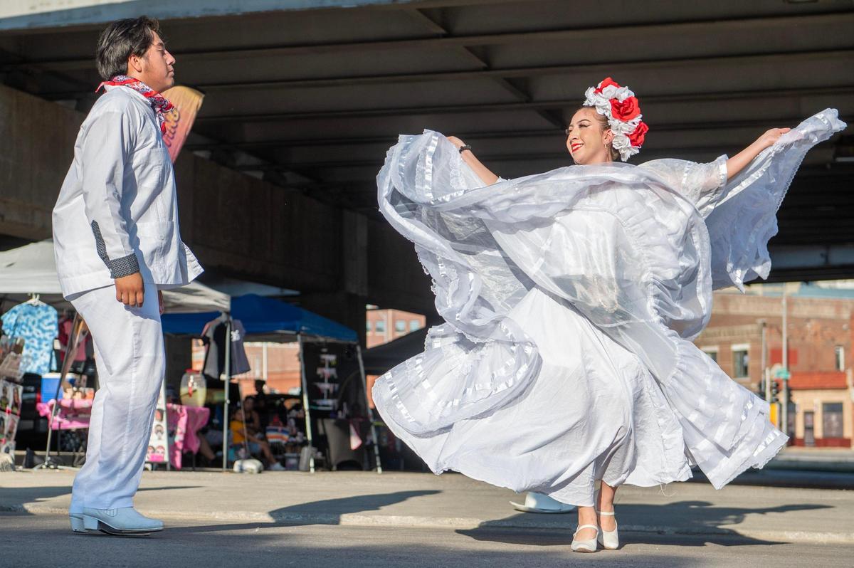 Jonathan Ceron, left, and Melissa Medrano of Los Bailadores de Kansas City, performed dances from several Mexican regions during August’s First Friday event.