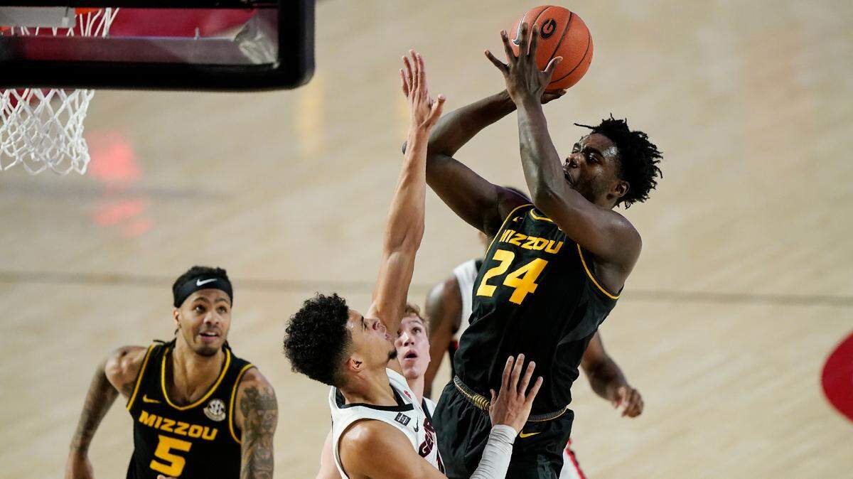 Missouri forward Kobe Brown (24) shoots against Georgia forward Toumani Camara during the first half of an NCAA college basketball game Tuesday, Feb. 16, 2021, in Athens, Ga. (AP Photo/Brynn Anderson)