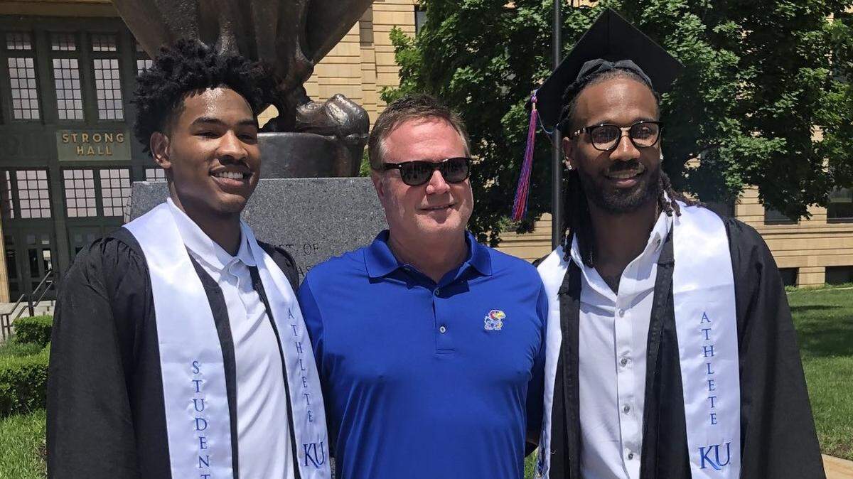 Kansas Jayhawks men’s basketball coach Bill Self joined graduates Ochai Agbaji, left, and Wayne Selden, Jr., right, at KU’s commencement exercises in Lawrence on Sunday.