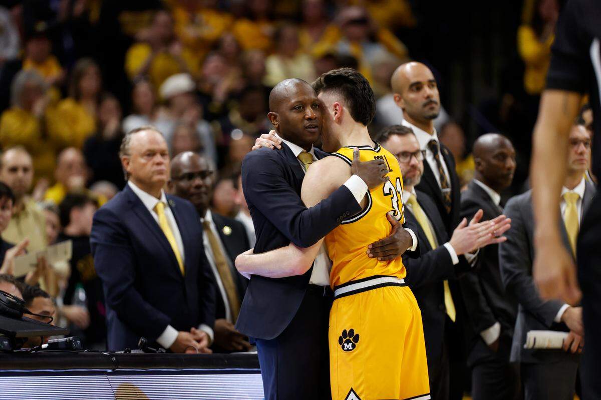Missouri Tigers guard Caleb Grill (31) hugs coach Dennis Gates in the last minute against the Kentucky Wildcats at Mizzou Arena on March 8, 2025.