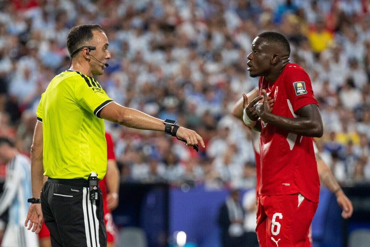 Switzerland midfielder Denis Zakaria (6) argues against a call with the referee in a 2026 FIFA World Cup quarterfinal match at Kansas City (Arrowhead) Stadium in Kansas City on Saturday, July 11, 2026.