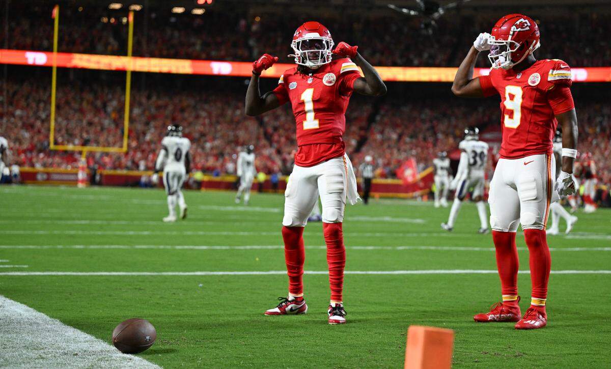Kansas City Chiefs wide receiver Xavier Worthy (1) celebrates with wide receiver JuJu Smith-Schuster (9) after Worthy ran in a reception for a touchdown against the Baltimore Ravens in the fourth quarter Thursday, Sept. 5, 2024, at GEHA Field at Arrowhead Stadium.