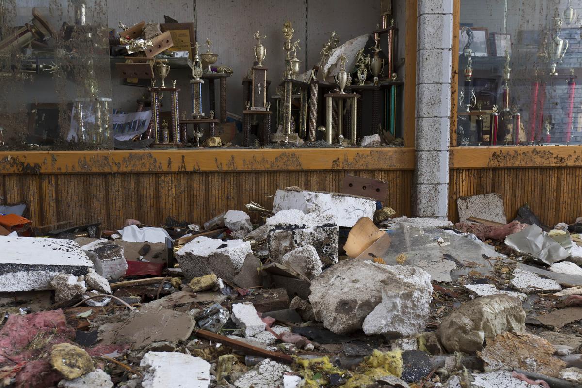 Athletic trophies inside Joplin High School were covered in dirt and rain following the devastation caused by a tornado that swept through the city’s central section.