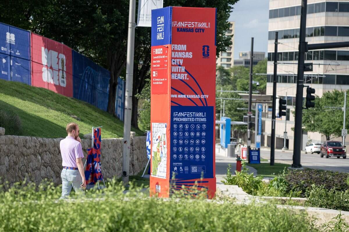 A pedestrian looks at the FIFA Fan Festival map along Main Street on Wednesday, June 10, 2026, in Kansas City.