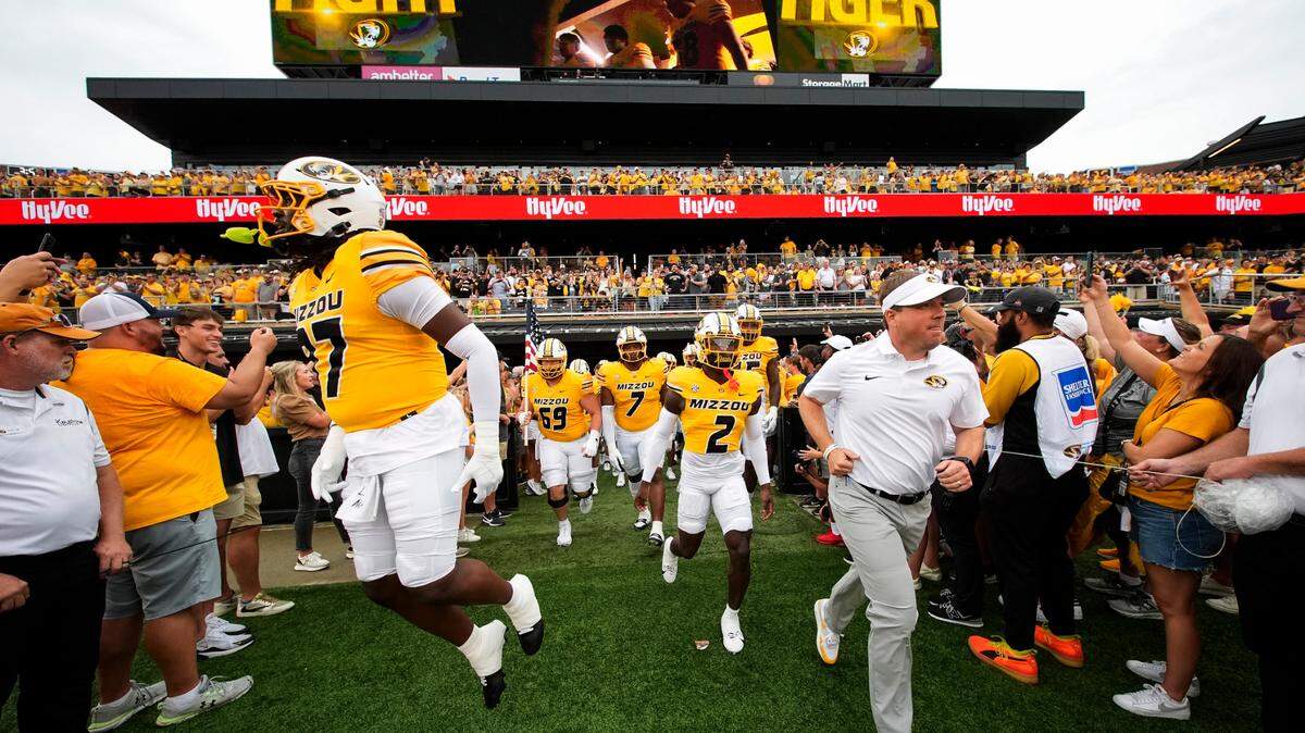 Sep 21, 2024; Columbia, Missouri, USA; Missouri Tigers head coach Eliah Drinkwitz leads his team onto the field prior to a game against the Vanderbilt Commodores at Faurot Field at Memorial Stadium.