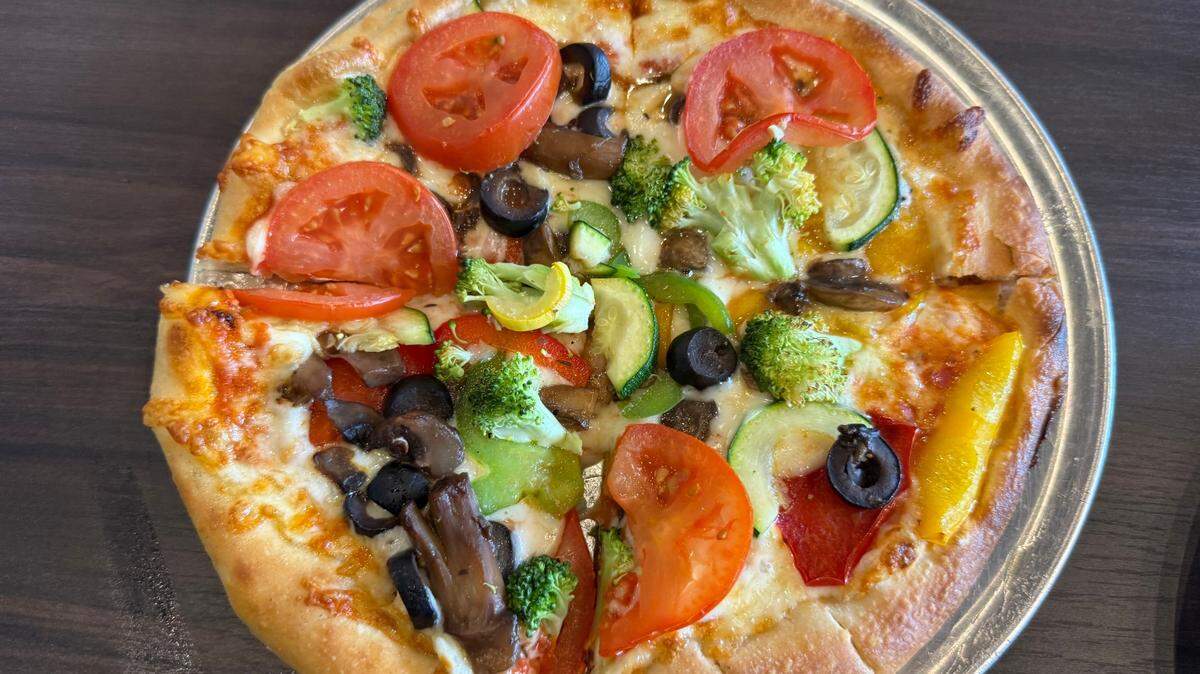 Martin City Tavern sells pizza with a variety of toppings.