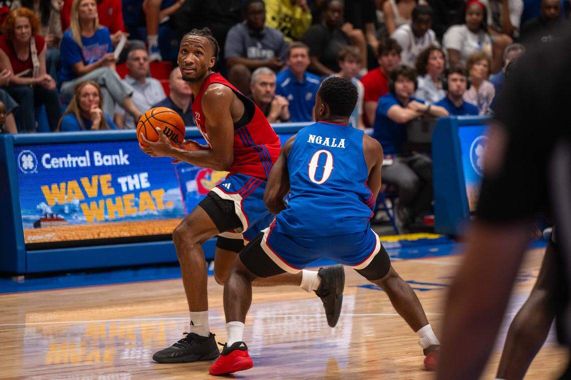 Kansas Jayhawks guard Darryn Peterson backs down guard Nginyu “Gee” Ngala during the men's scrimmage at Late Night in the Phog, on Friday, October 17, 2025, in Lawrence.